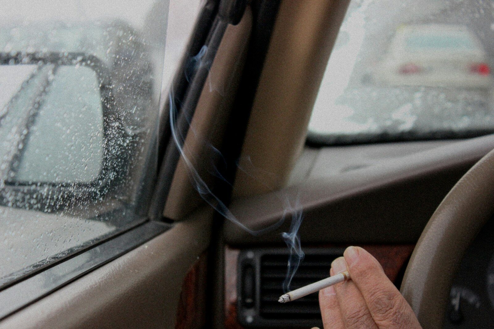 Smoking a cigarette inside a car