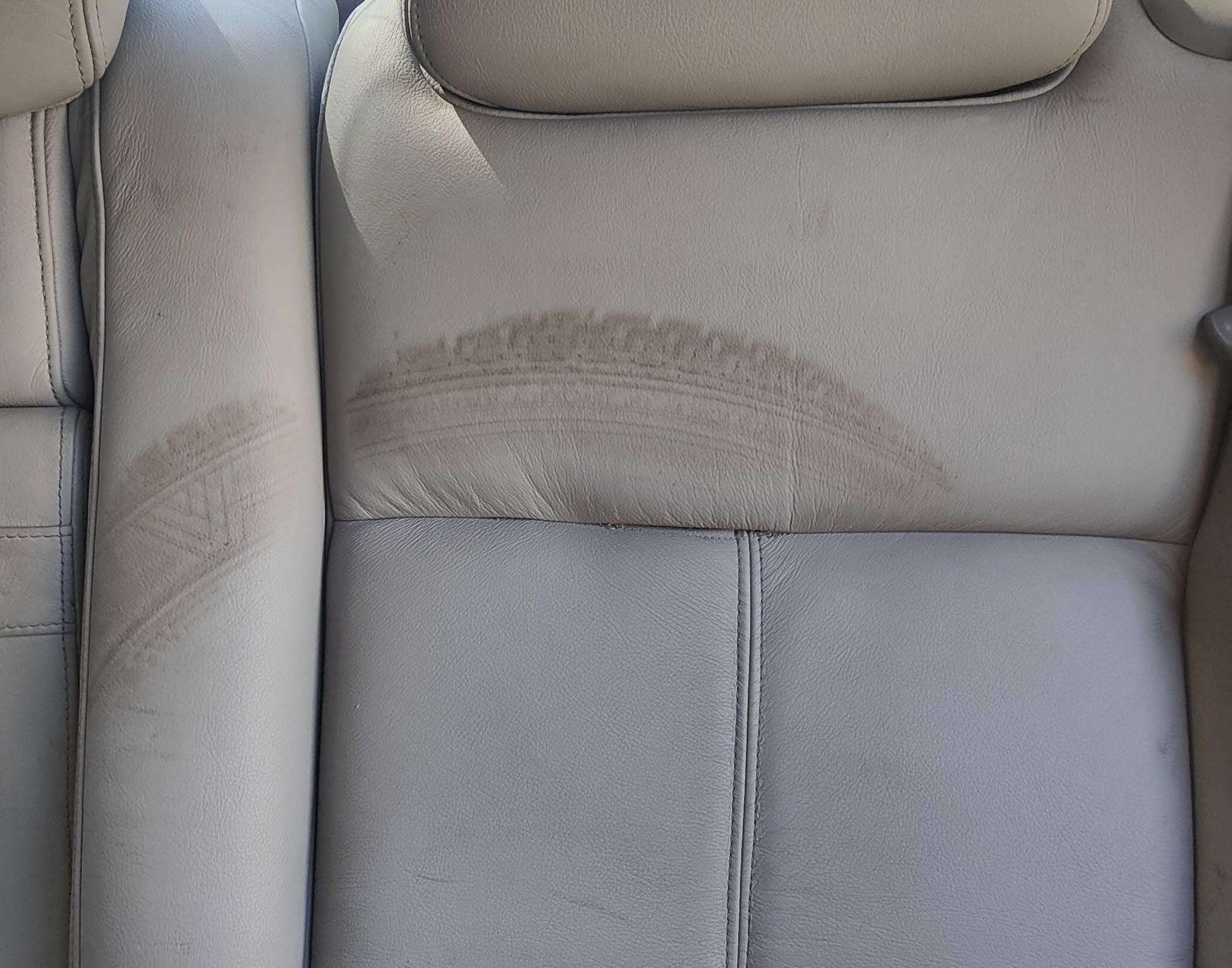 Stained leather car seat cover
