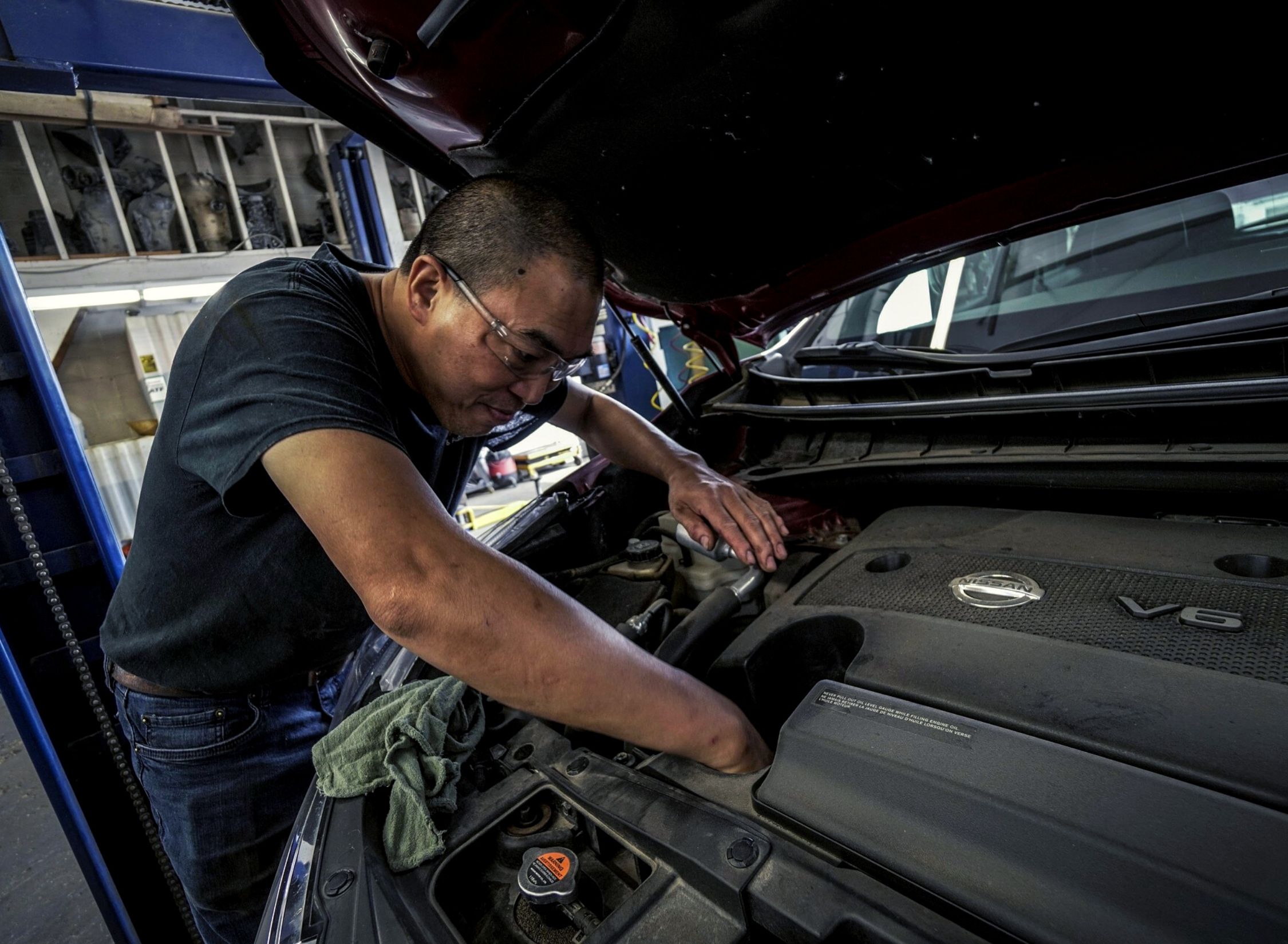 Technician working on the engine