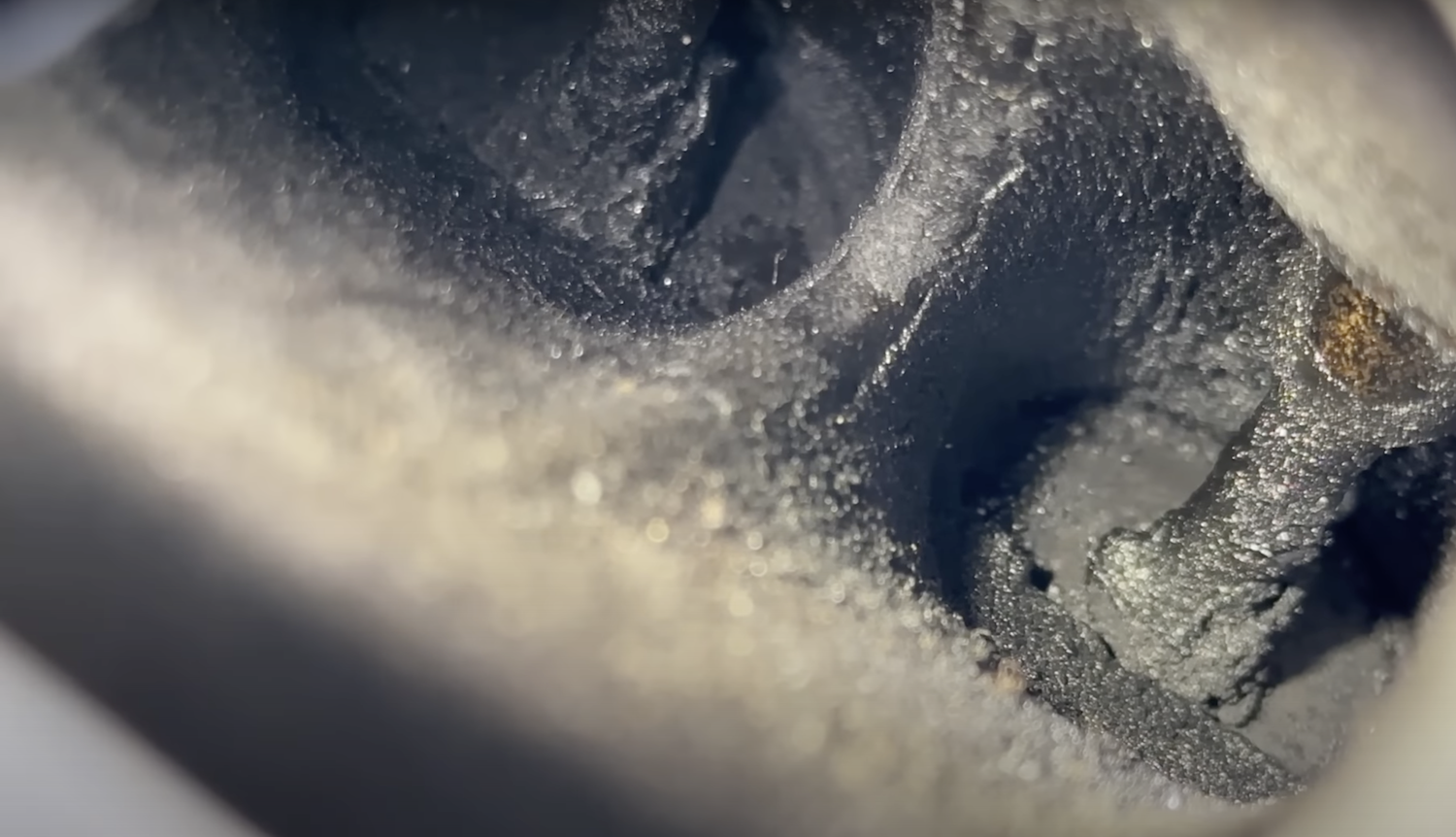 Carbon buildup on the intake valves and ports of a direct injection engine