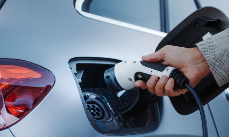 Charging connector into the vehicle's port