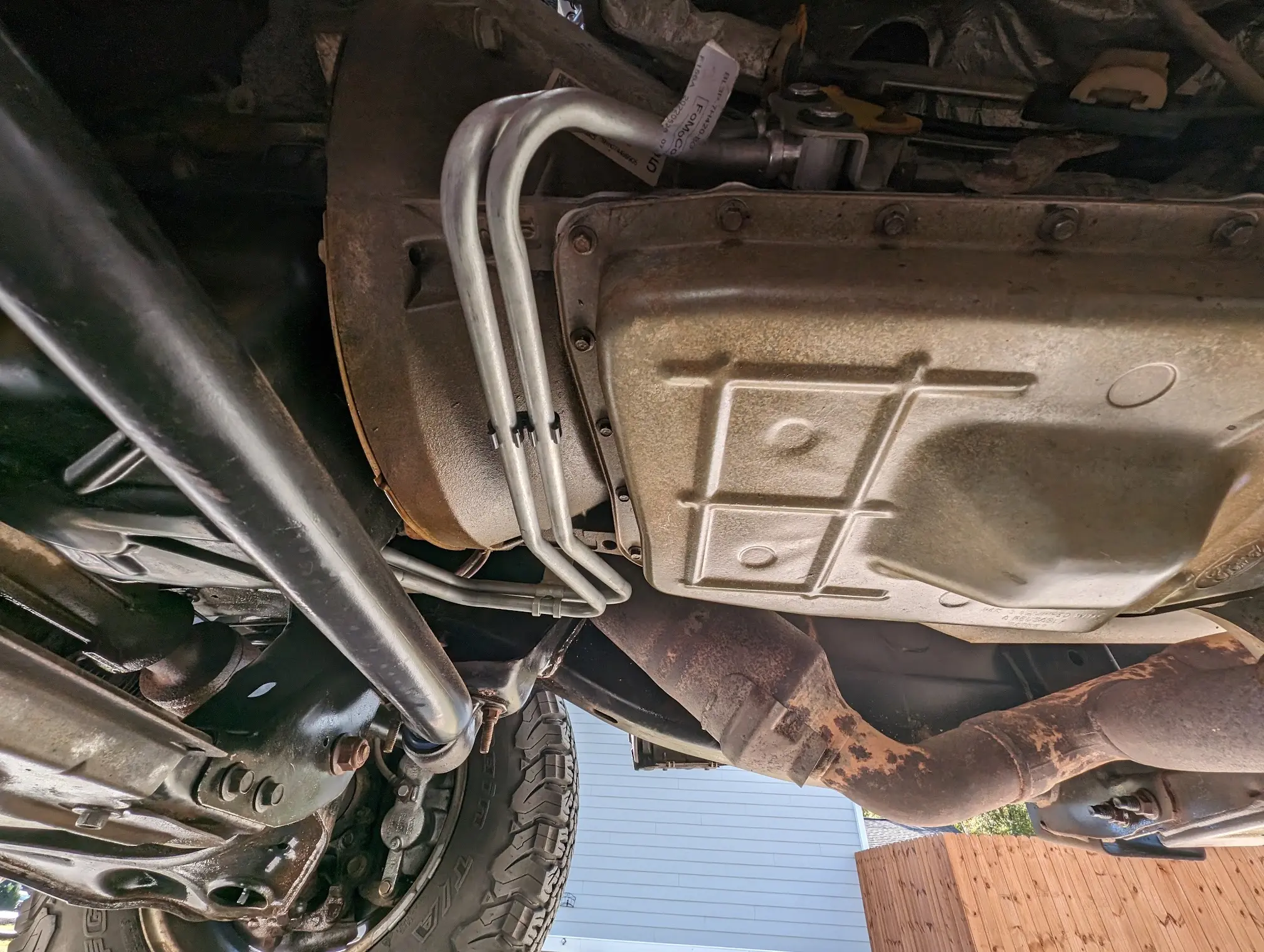 Transmission pan and cooler lines