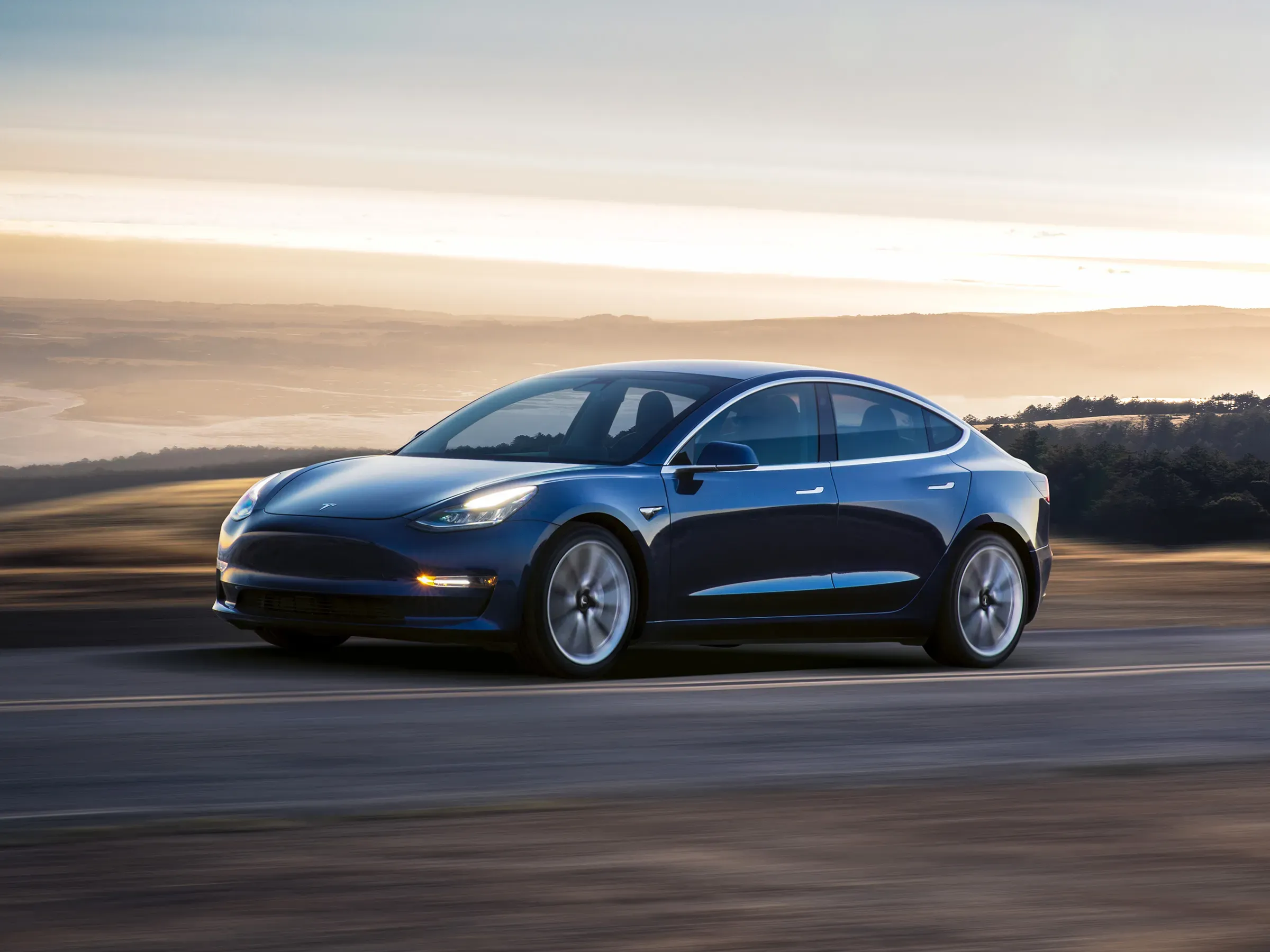 blue Tesla Model 3 sedan blue Tesla Model 3 sedan