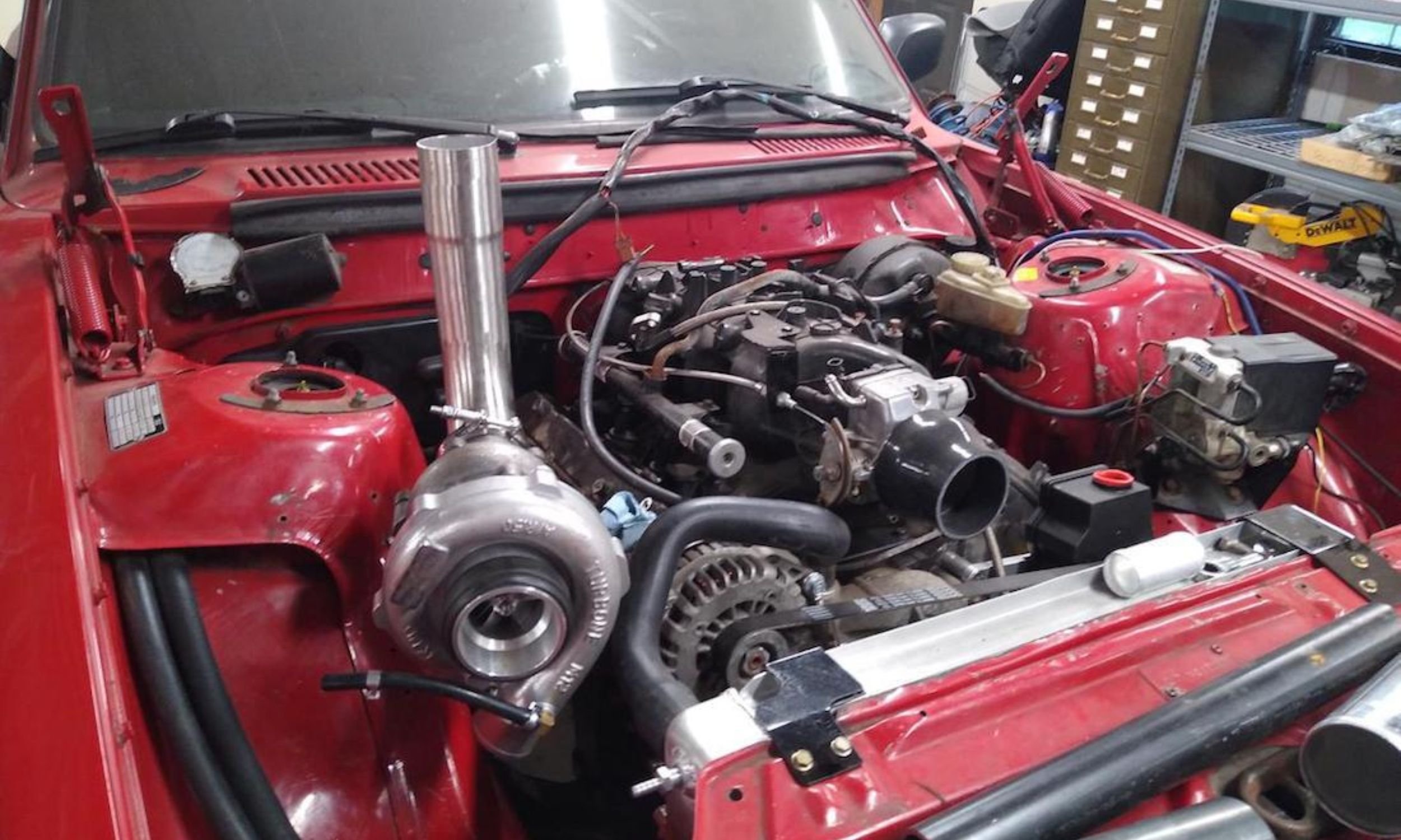 Project to swap a turbocharged GM LS engine into a red Volvo 240