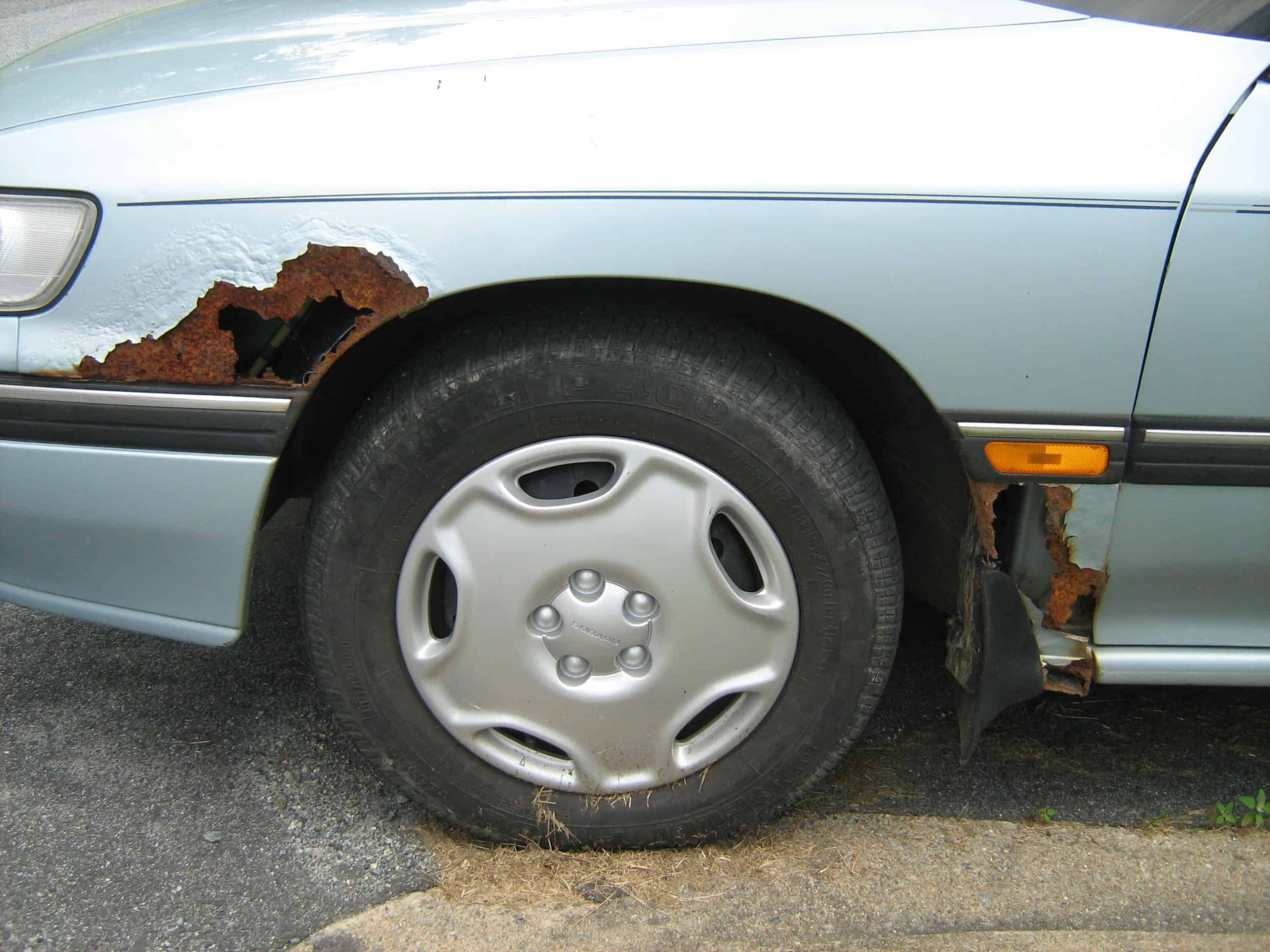 Rust damage on a Subaru station wagon fender