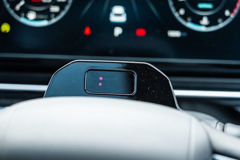 Close-up of a driver monitoring camera above a modern car dashboard