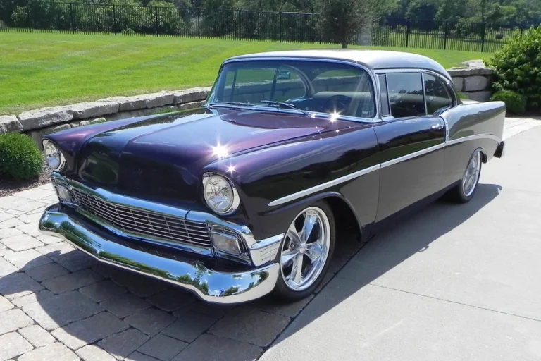 A 1956 Chevrolet "210 Custom 2 Door Coupe is standing in a parking