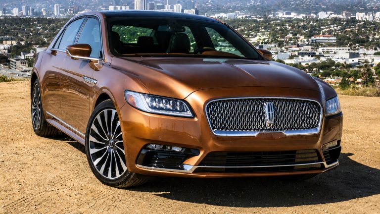 2017 Lincoln Continental parked with a panoramic city skyline backdrop