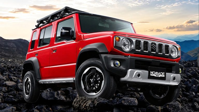 bright red Suzuki Jimny Nomade off-road vehicle parked on rocky terrain under cloudy skies