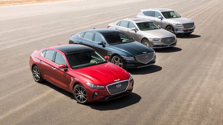 Four different Genesis cars and an SUV parked sequentially on an open tarmac surface