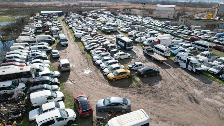 Large impound lot filled with recovered cars