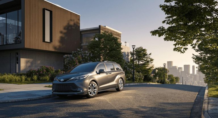Modern Toyota Sienna parked outside a contemporary home at golden hour