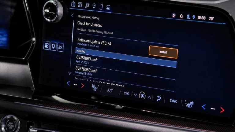 modern car infotainment touchscreen displaying software update and history menu options