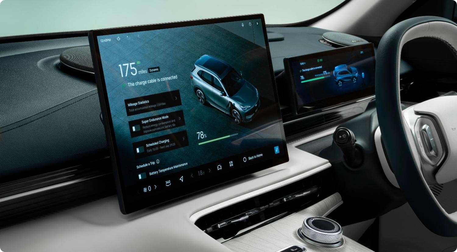Electric vehicle parked outdoors with battery range information visible on dashboard screen