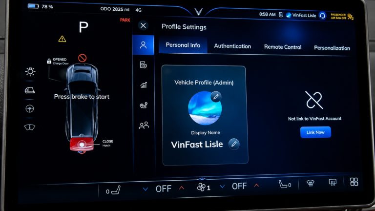 Modern electric vehicle interior with illuminated touchscreen and digital dashboard