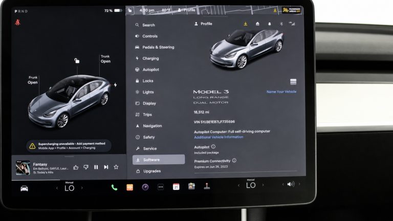 Tesla touchscreen dashboard displaying vehicle settings, controls, software information, and a 3D car model