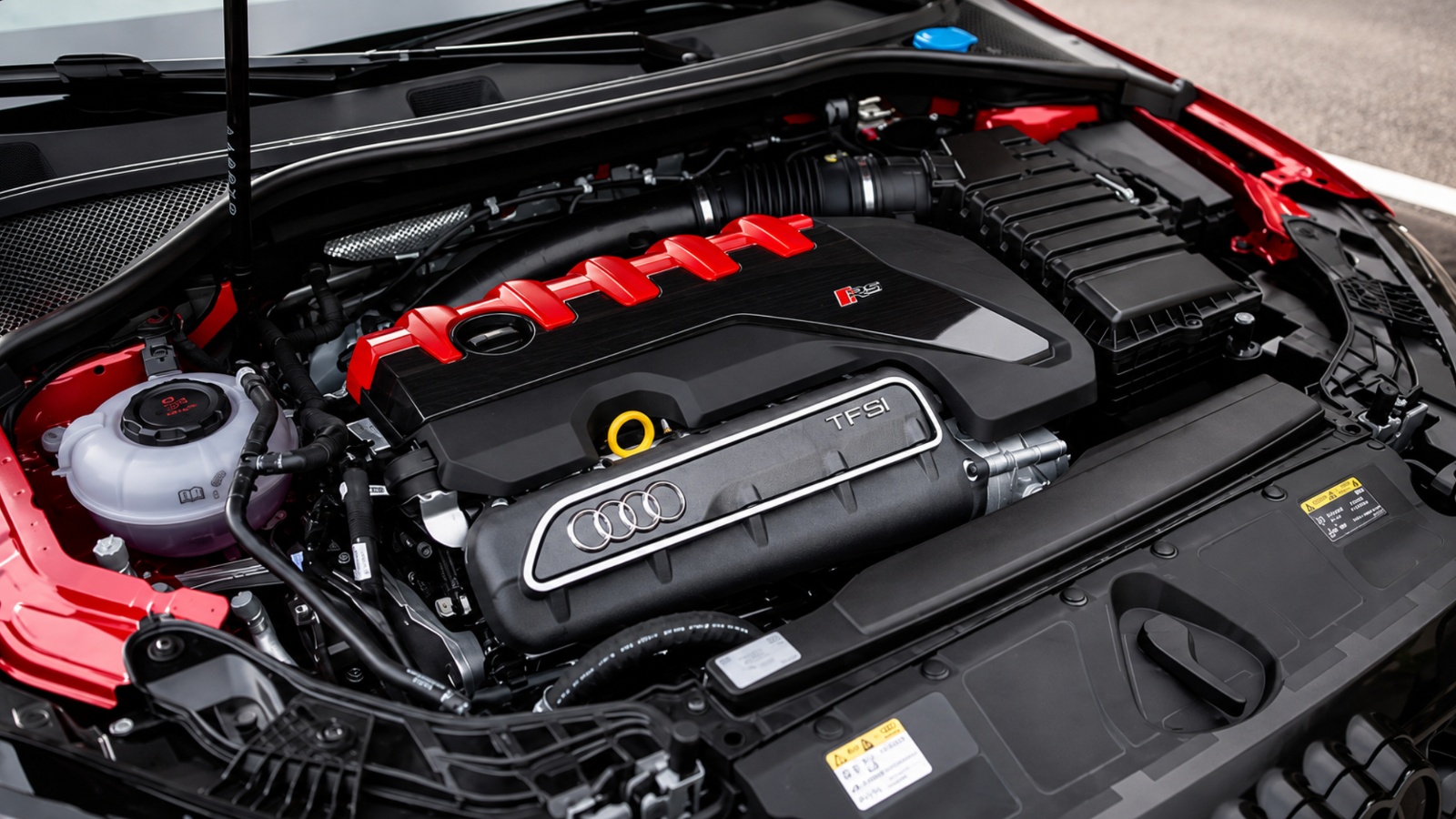 clean high-resolution view of a modern Audi TFSI engine bay under an open hood