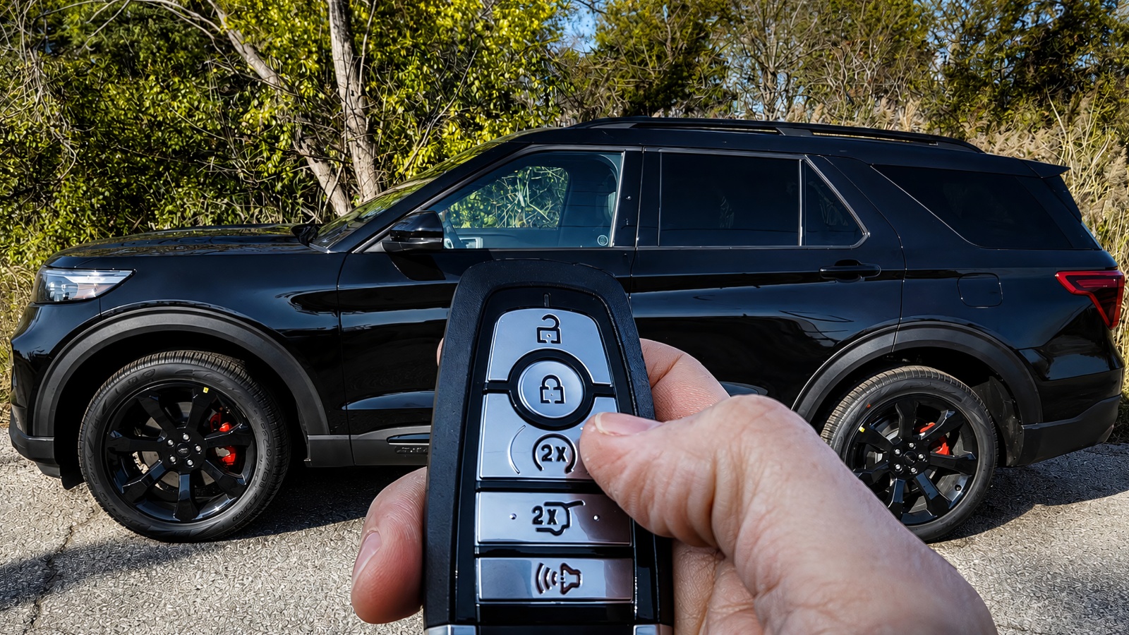 Modern SUV parked outdoors with smart key fob and keyless entry system