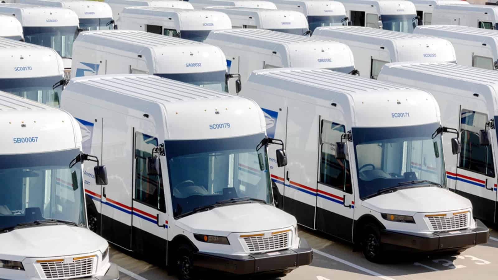 A fleet of USPS electric delivery trucks