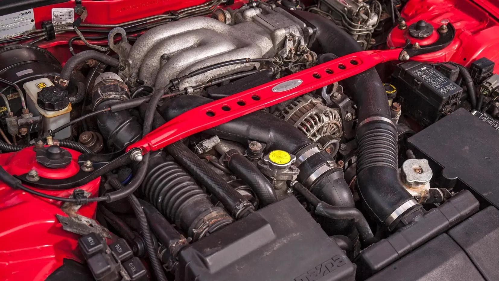 A red Rotary Engine is shown in the image