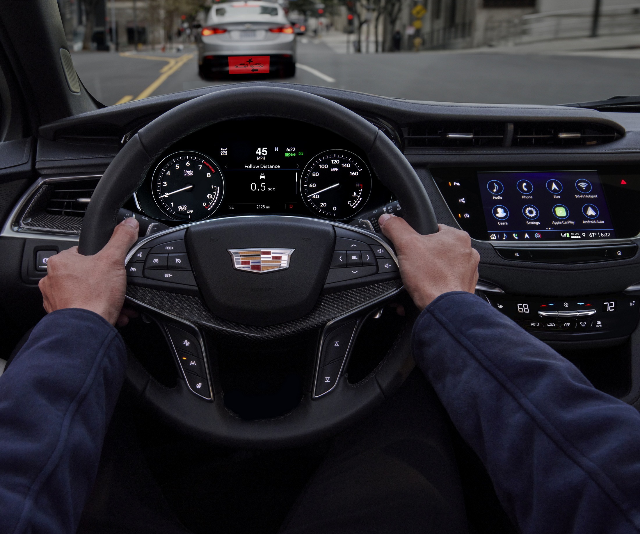 Cadillac XT5, showing hands on the leather-wrapped steering wheel