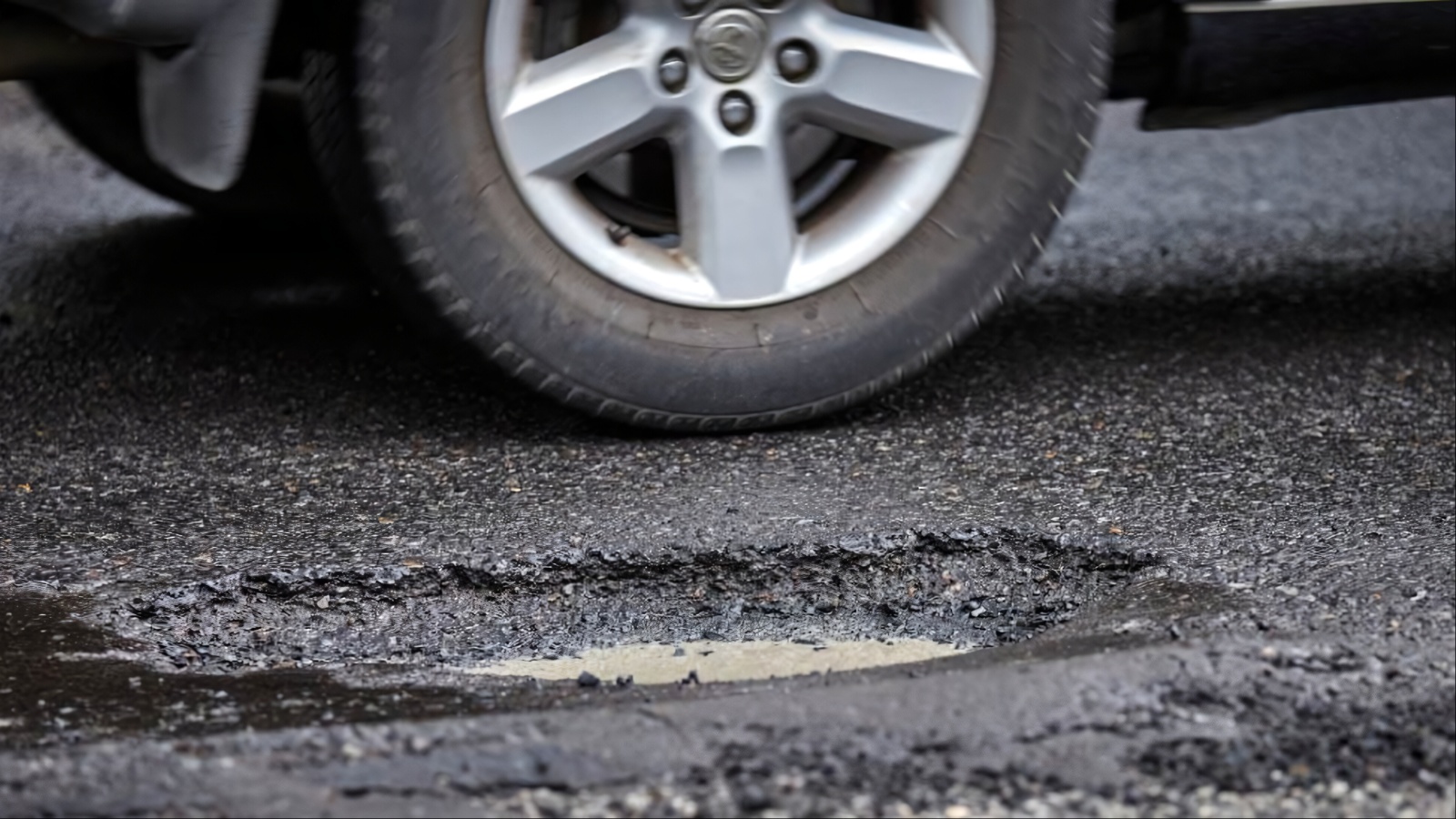 Damage Caused by Potholes, Rocks, Weather, or Road Debris