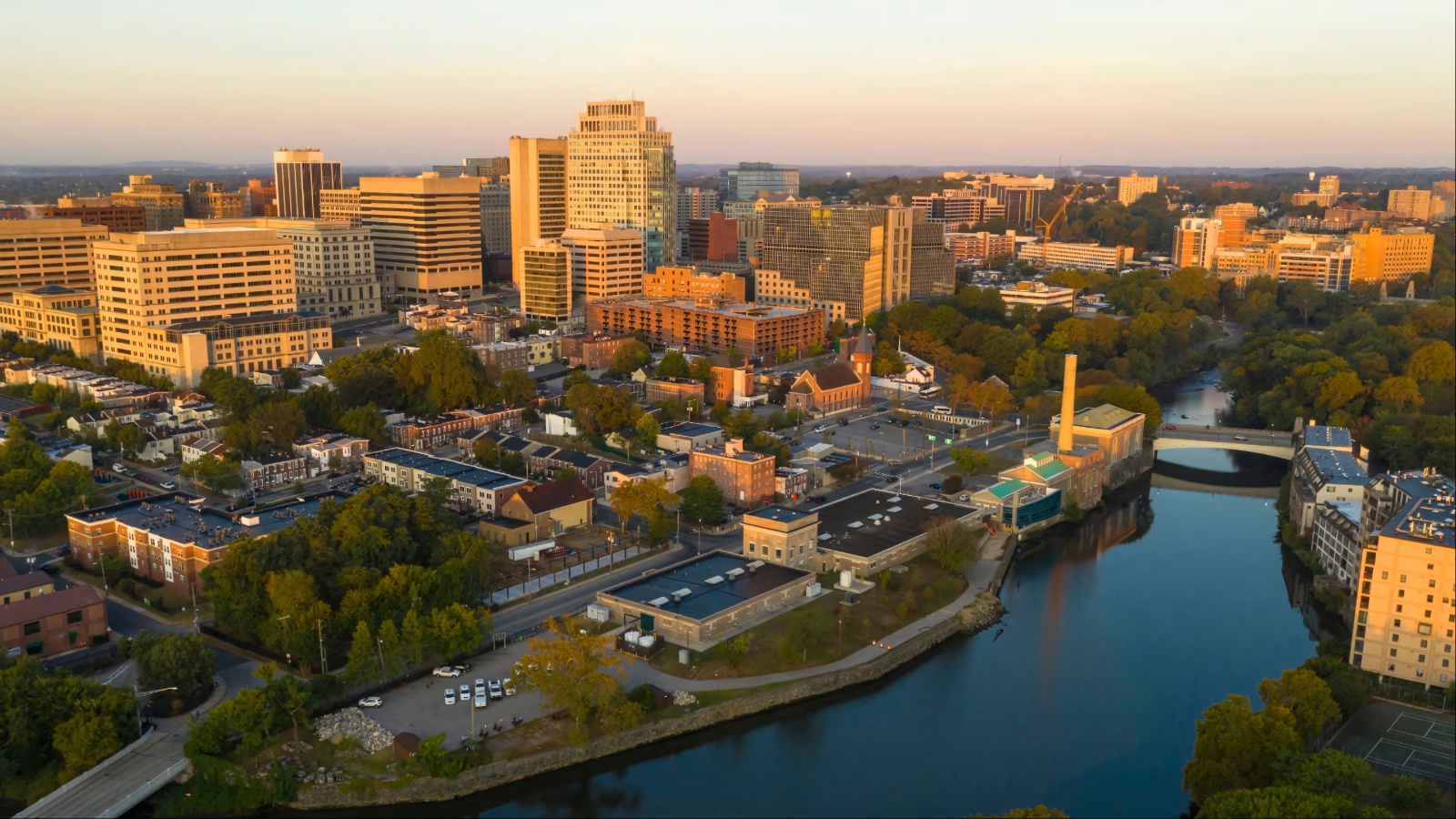 Aerial view of Wilmington, Delaware skyline and river at sunset