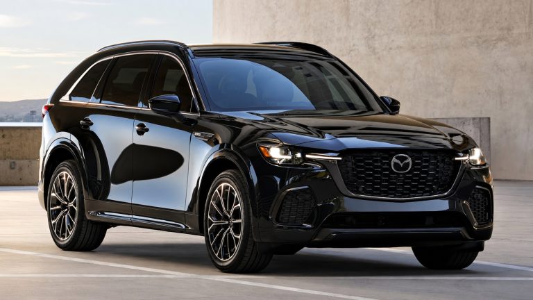 A sleek, glossy black Mazda SUV parked on an outdoor concrete rooftop during daytime