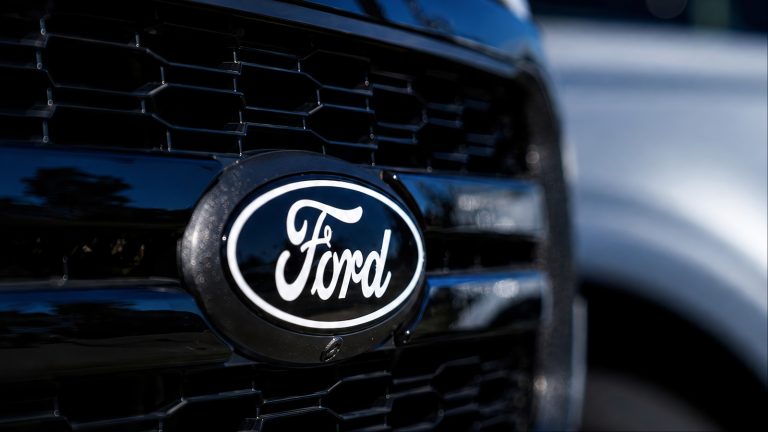 Close-up shot of a black Ford vehicle front grille logo
