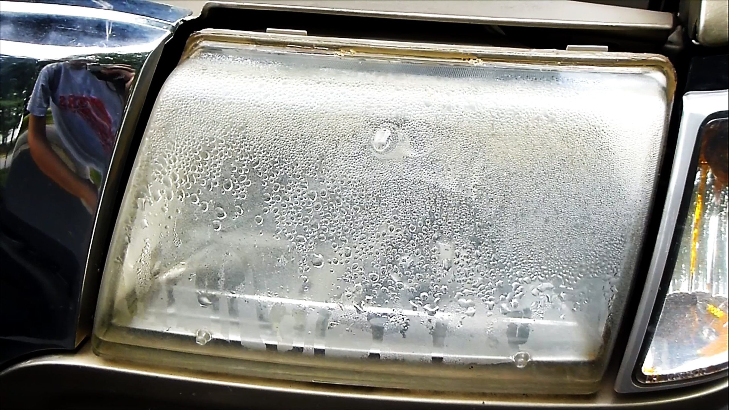 Heavy condensation and water droplet accumulation inside a car headlight
