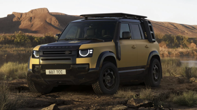 A brown Land Rover in a hilly area