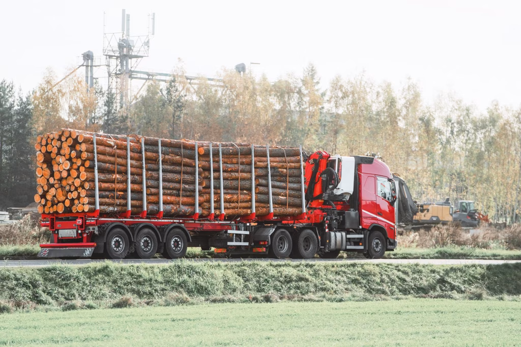 Logging Trucks With Heavy Timber Loads