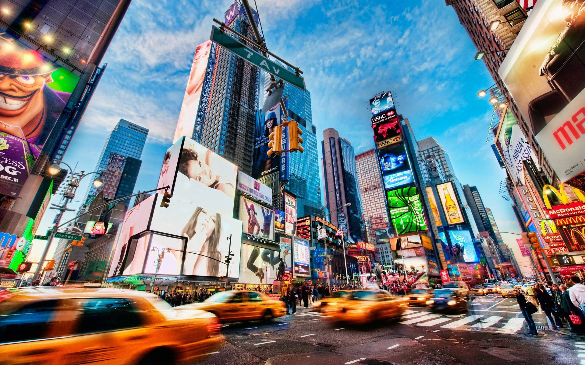 New York City's Times Square buzzing with traffic and bright billboards