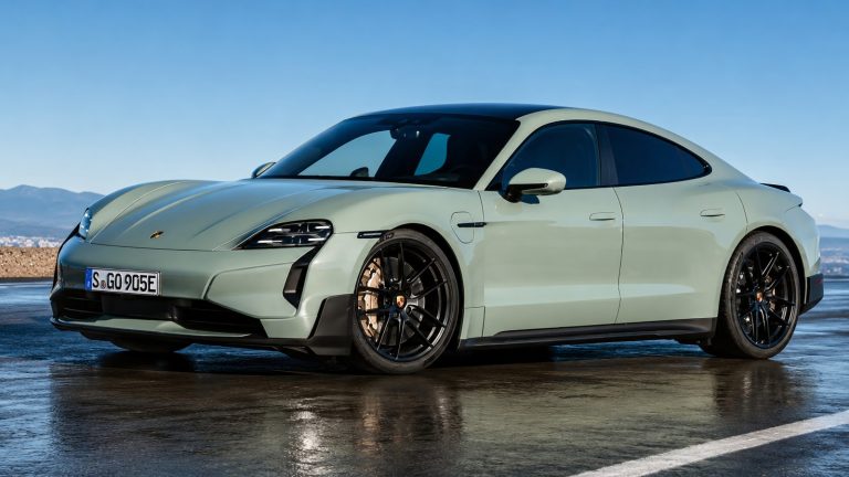 Porsche Taycan parked with sleek styling under a clear sky
