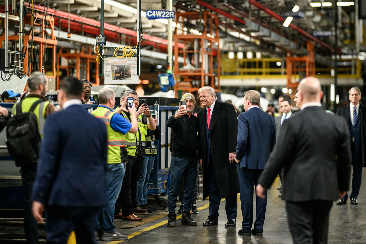 President Donald Trump talks with workers at Ford’s F-150 factory