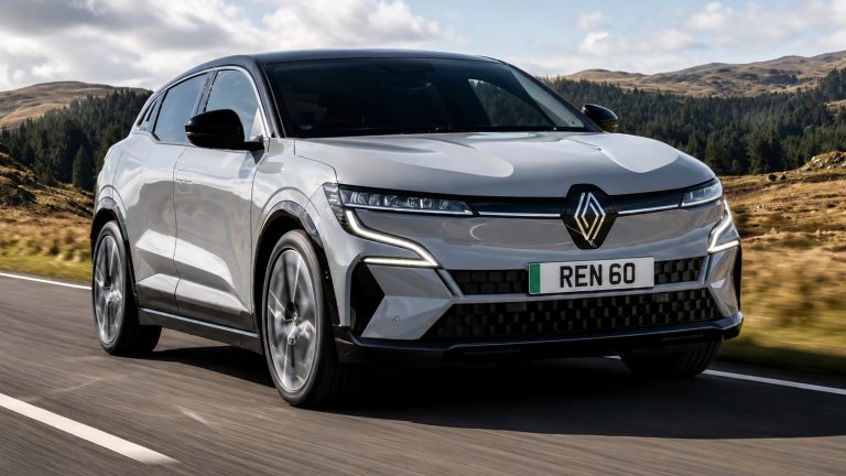 Renault Megane E-Tech Electric driving through a scenic countryside landscape
