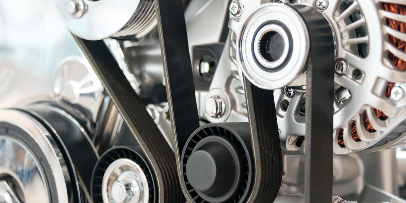 Serpentine belt and timing belt system in a car engine