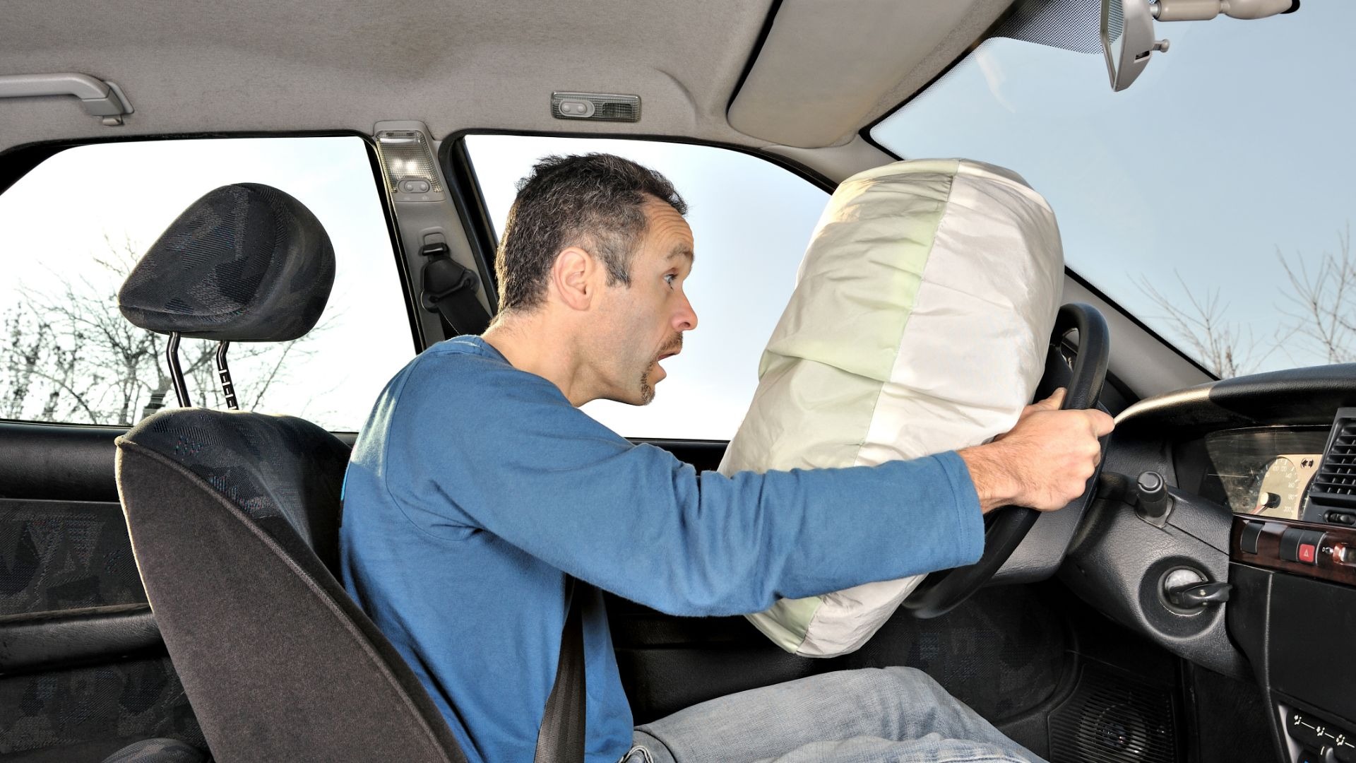 Vehicle safety airbag deploying during a collision