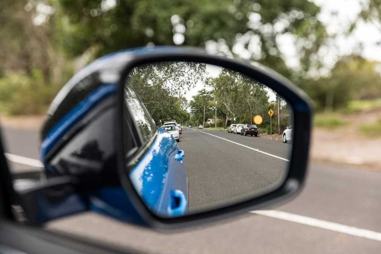 View through a car's side mirror