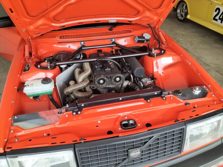 A Volvo redblock engine in shown in a volvo car