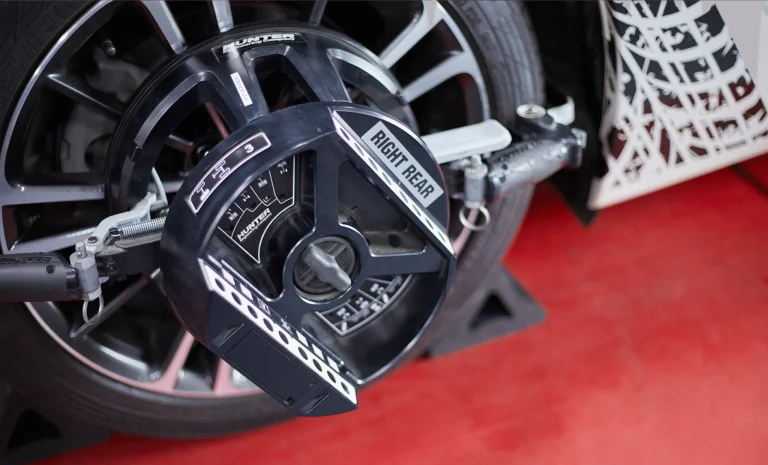 A Wheel Alignment equipment is attached to a tire