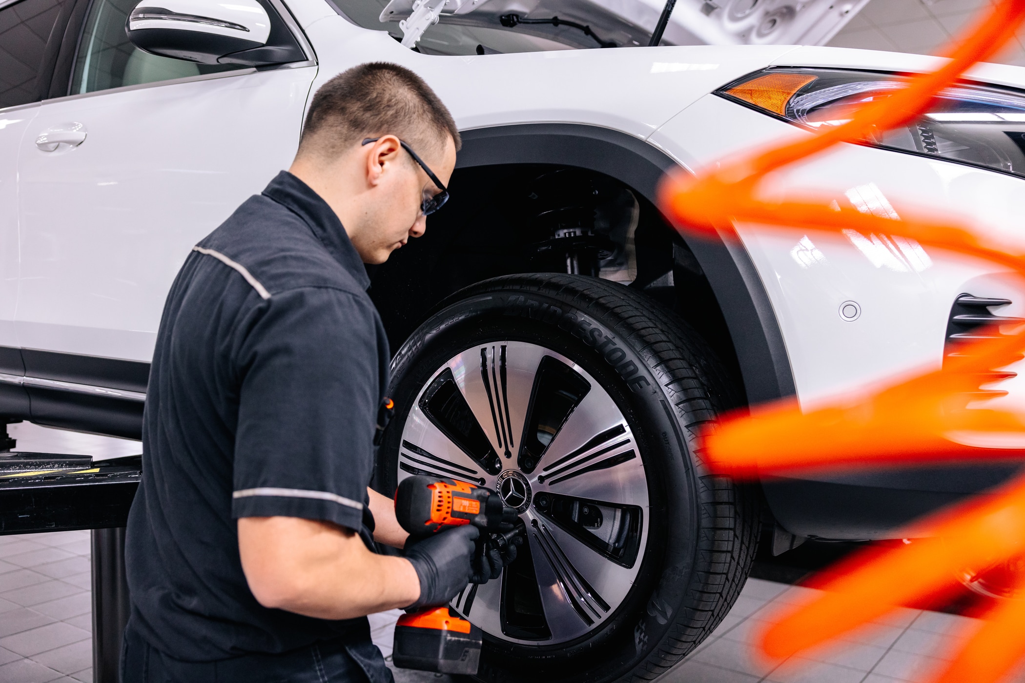 Wheel of a white Mercedes Benz electric vehicle Wheel of a white Mercedes Benz electric vehicle