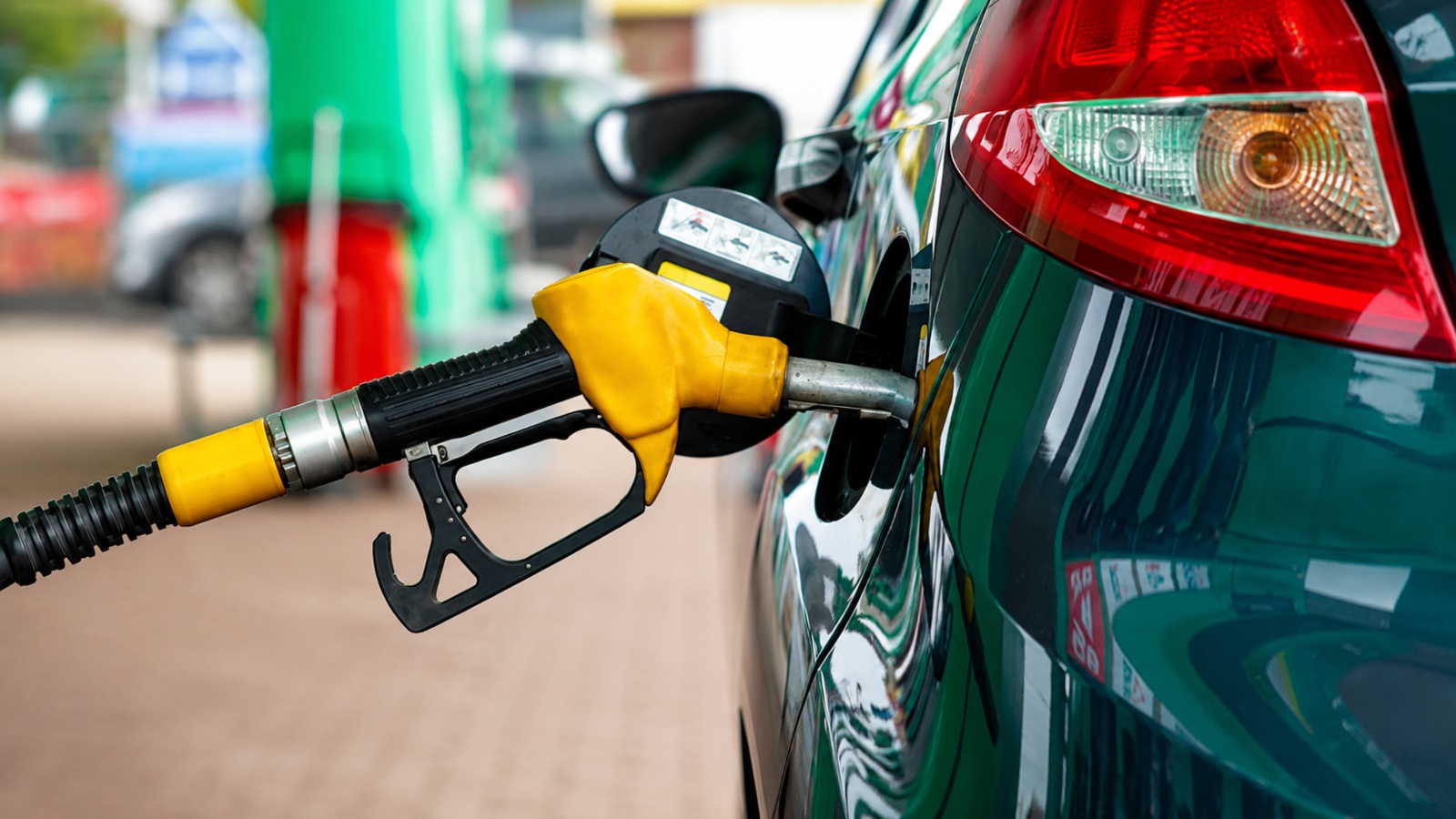 A fuel pump nozzle in a car's fuel tank
