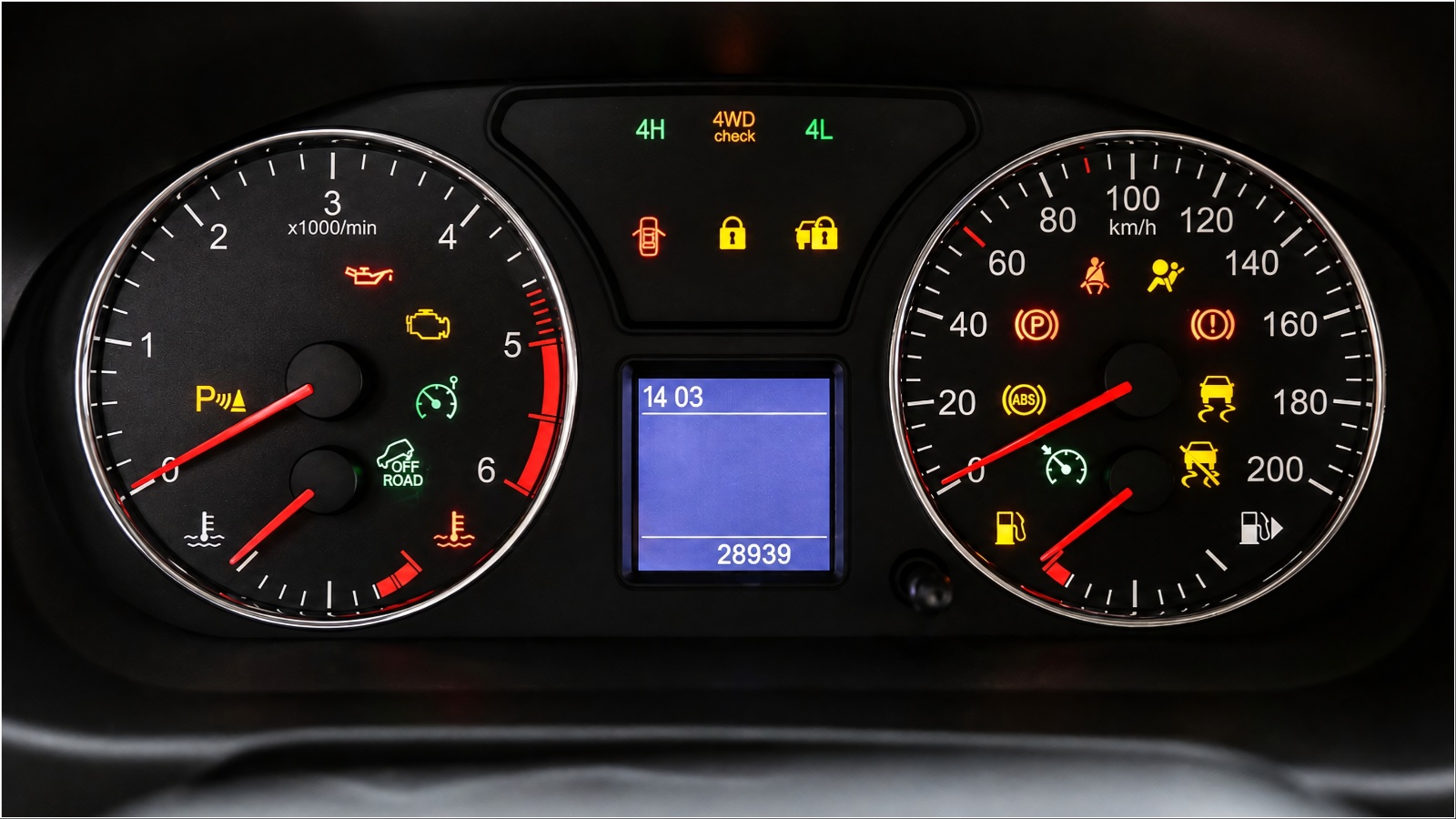 A vehicle dashboard displays multiple warning and indicator lights illuminated across the instrument cluster