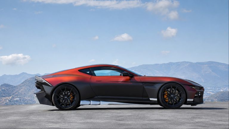 Aston Martin Valen showcasing an aggressive profile against a dramatic mountain backdrop