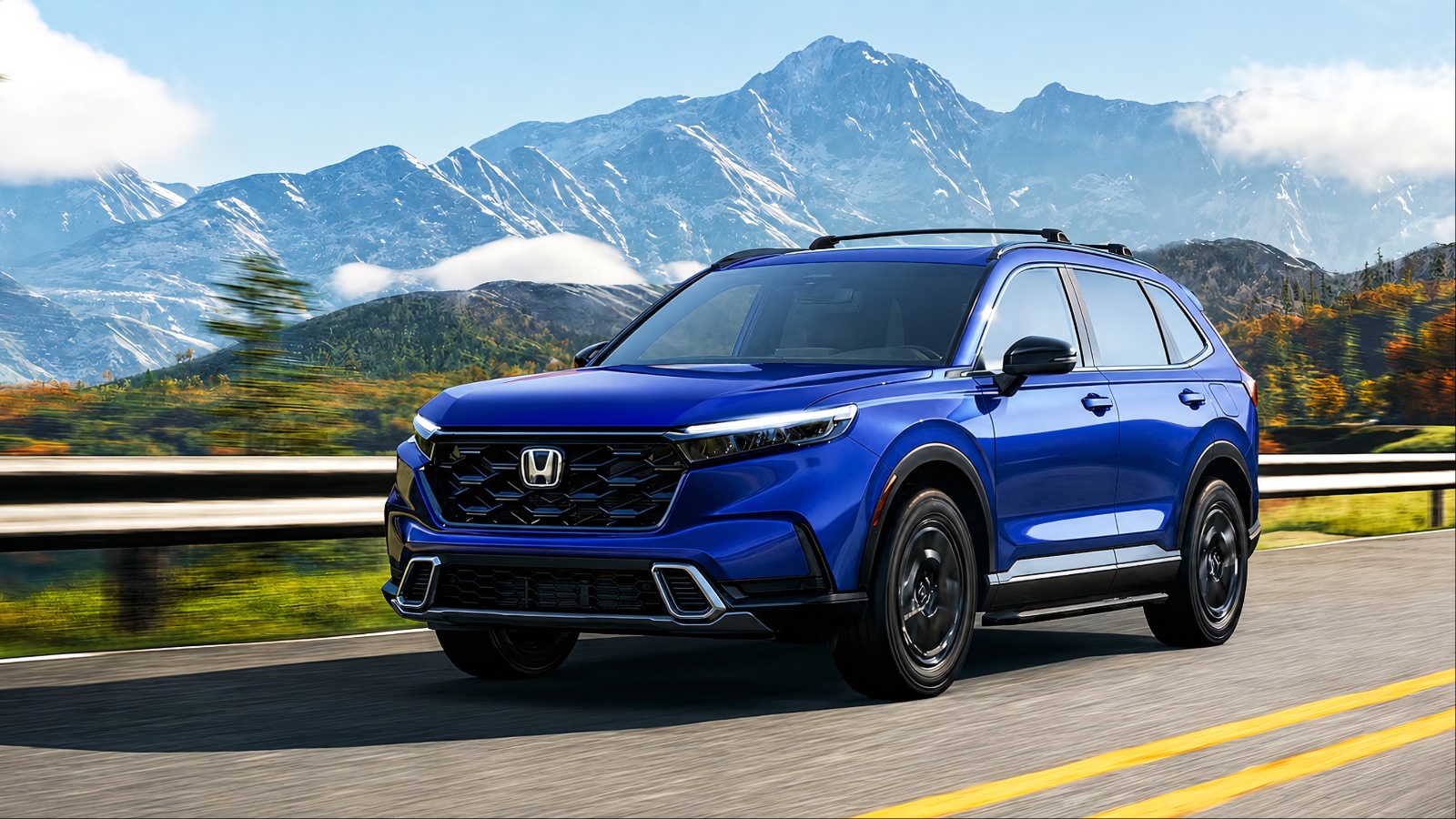 blue Honda SUV drives on a scenic highway with snow-capped mountains in the background