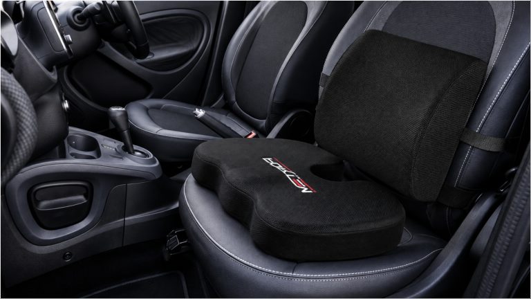 Car seat with orthopedic cushion and lumbar support pillow installed
