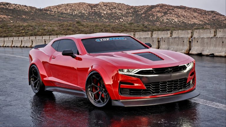 Chevrolet Camaro SS parked on a wet road with mountains and dramatic scenery