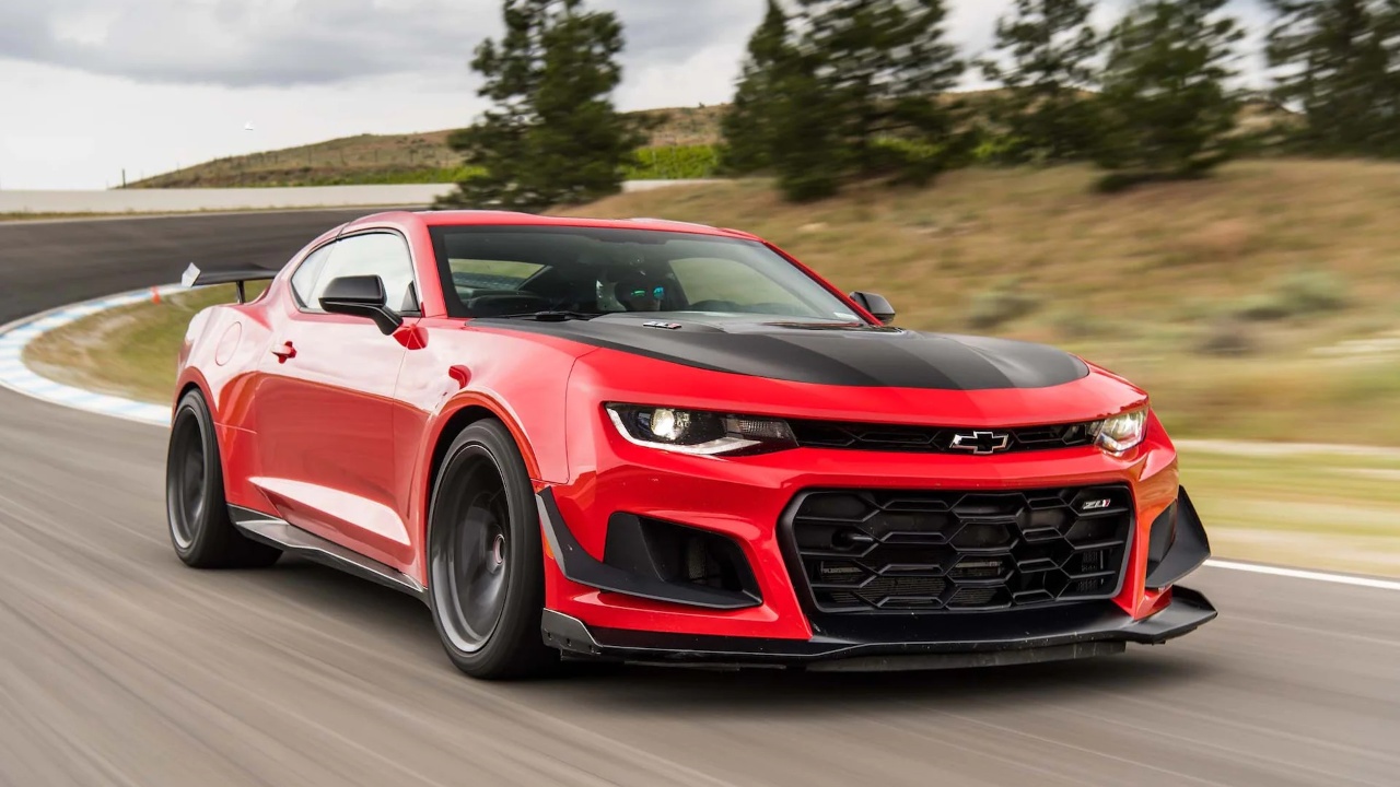 Chevrolet Camaro ZL1 racing around a track with aggressive styling and performance-focused design