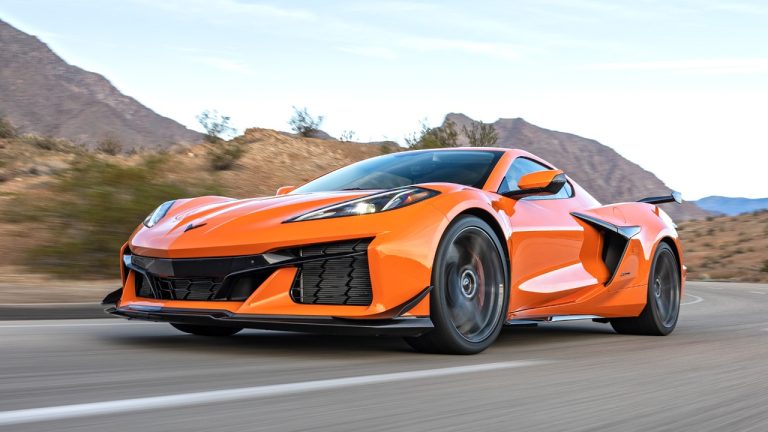 Chevrolet Corvette driving through a scenic desert mountain road